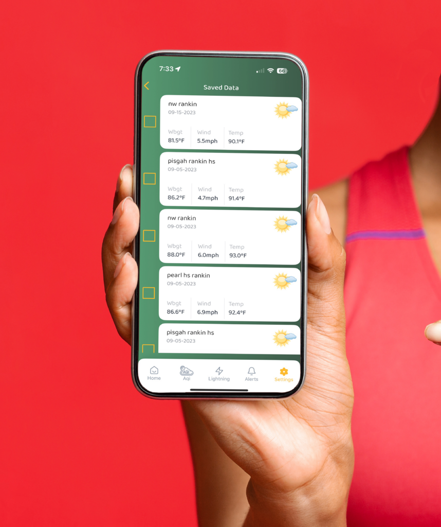 A lady's hand holding up the Zelus system app showing saved data for risk management.